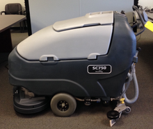 Load image into Gallery viewer, Refurbished Advance SC750™ 26D Walk-Behind Floor Scrubber Four 242 Ah wet batteries, EcoFlex™, shelf charger, pad holders