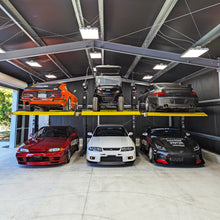 Load image into Gallery viewer, BendPak PL6000DCX Wide Two-Post Parking Lift - 6,000-lbs. Capacity - Shared Columns (5175625)