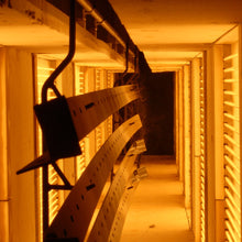 Load image into Gallery viewer, Binks electric infrared booster oven installed on a conveyor line with control cabinet and glowing emitter banks